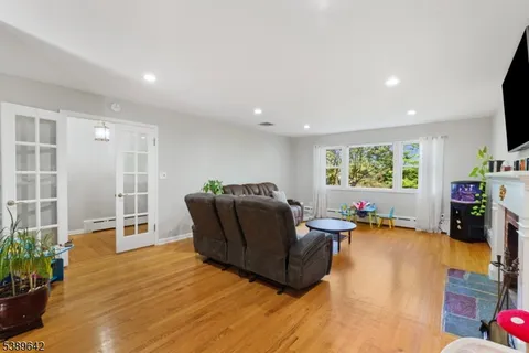 a living room with furniture window and wooden floor