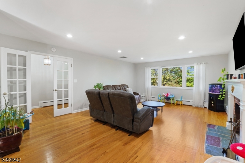 202 Mt Horeb Road Warren, NJ 07059 - Photo 7 of 23 a living room with furniture window and wooden floor