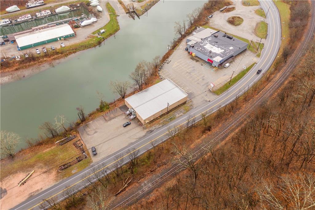 26 Front Street Millsboro, PA 15348 - Photo 11 of 24 an aerial view of a house with a lake view