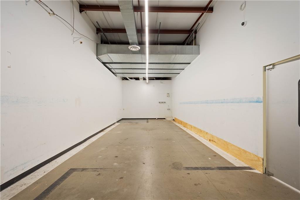 26 Front Street Millsboro, PA 15348 - Photo 19 of 24 a view of a room with racks on the wall