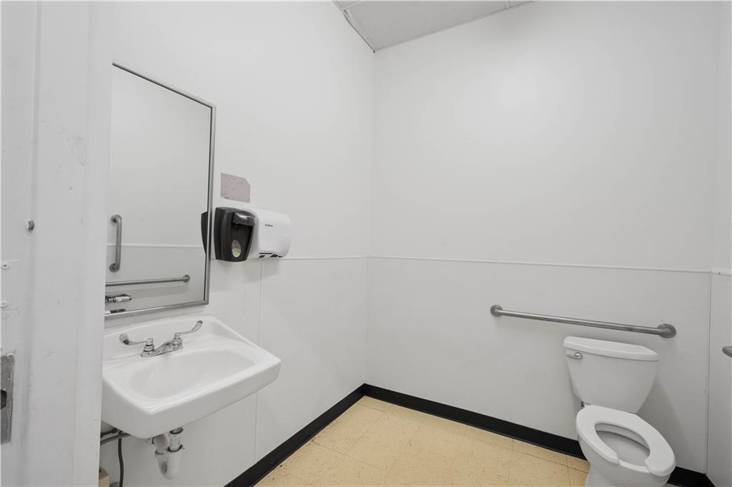 26 Front Street Millsboro, PA 15348 - Photo 22 of 24 a bathroom with a sink toilet and mirror