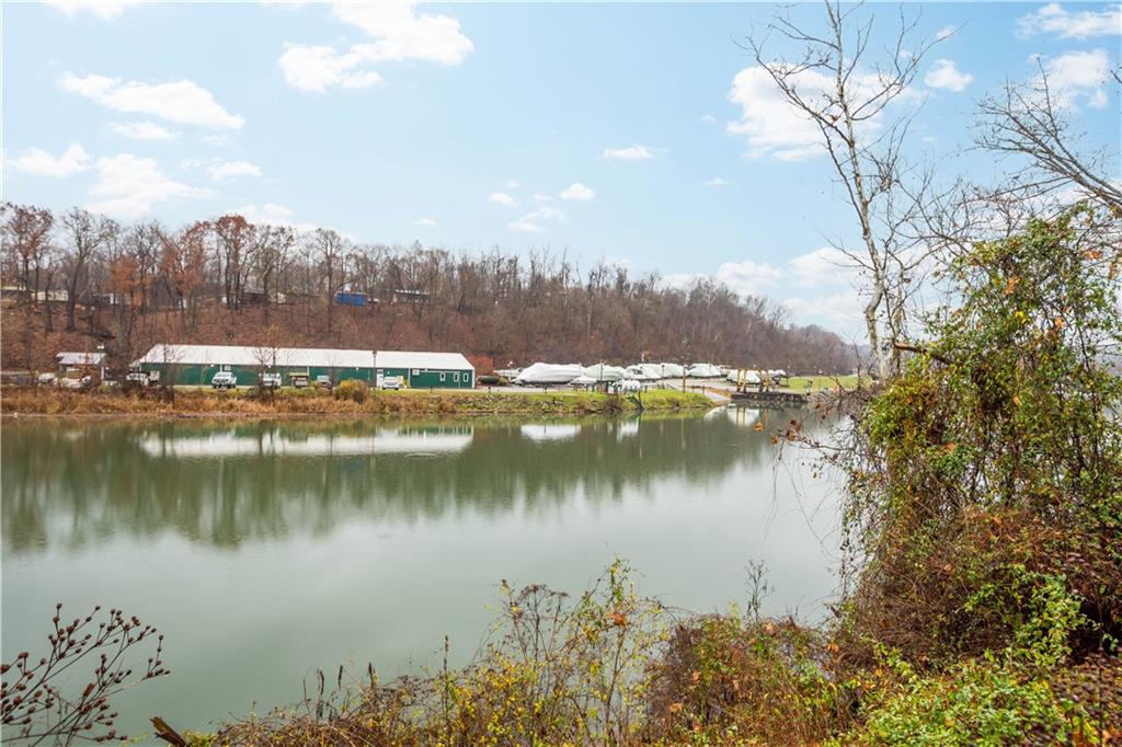 26 Front Street Millsboro, PA 15348 - Photo 9 of 24 a view of a lake with a mountain