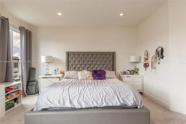 a bedroom with a bed and window