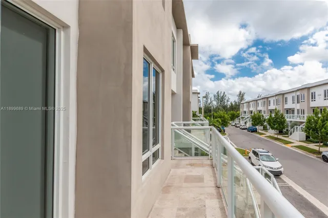 a view of a city from a corridor