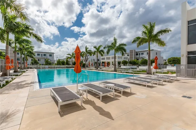 a view of a swimming pool with a lounge chairs