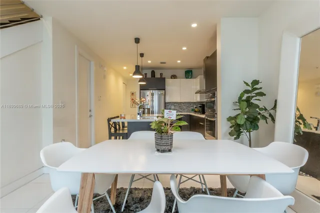a kitchen with a table and chairs