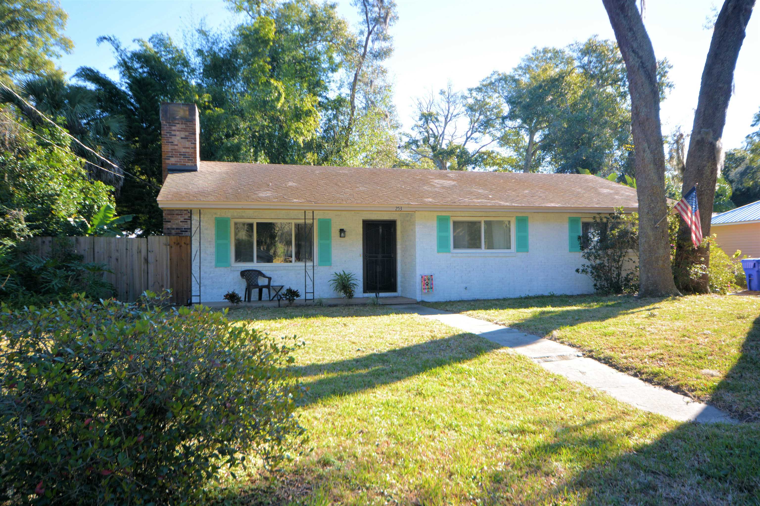 253 Mimosa Road St. Augustine, FL 32086 - Photo 1 of 42 a front view of a house with a garden