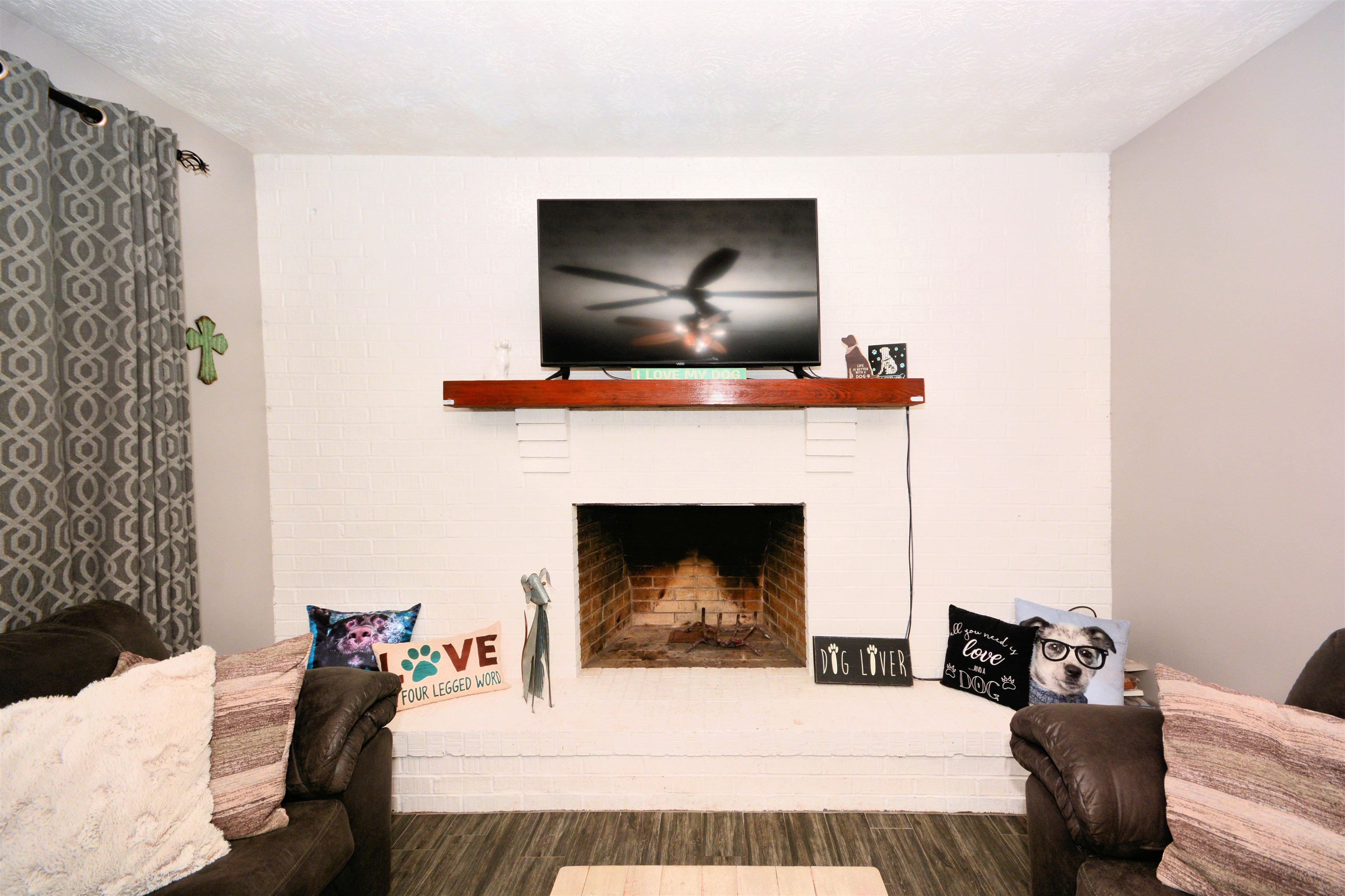 253 Mimosa Road St. Augustine, FL 32086 - Photo 16 of 42 a living room with furniture and a fireplace