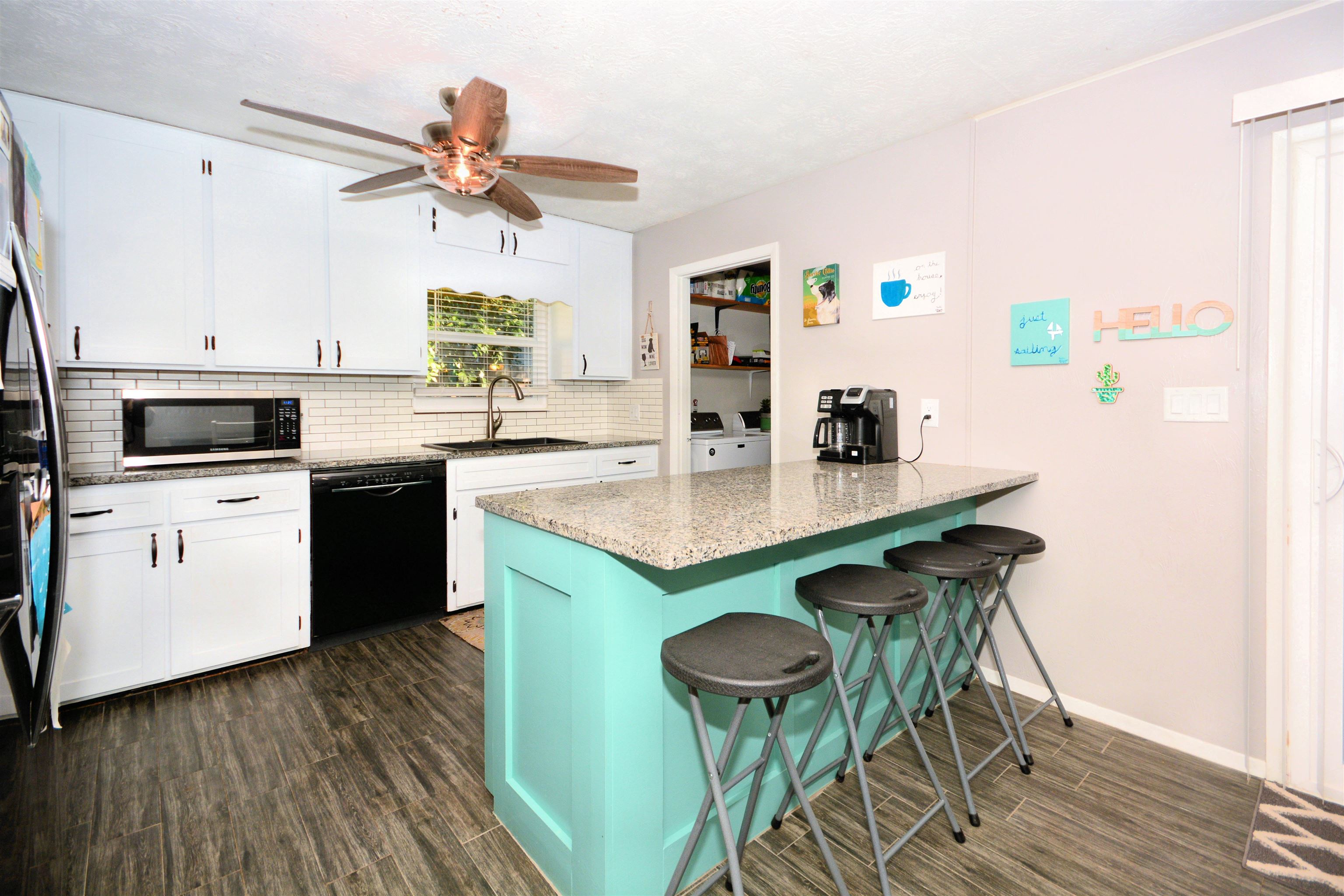 253 Mimosa Road St. Augustine, FL 32086 - Photo 21 of 42 a kitchen with a sink cabinets and wooden floor