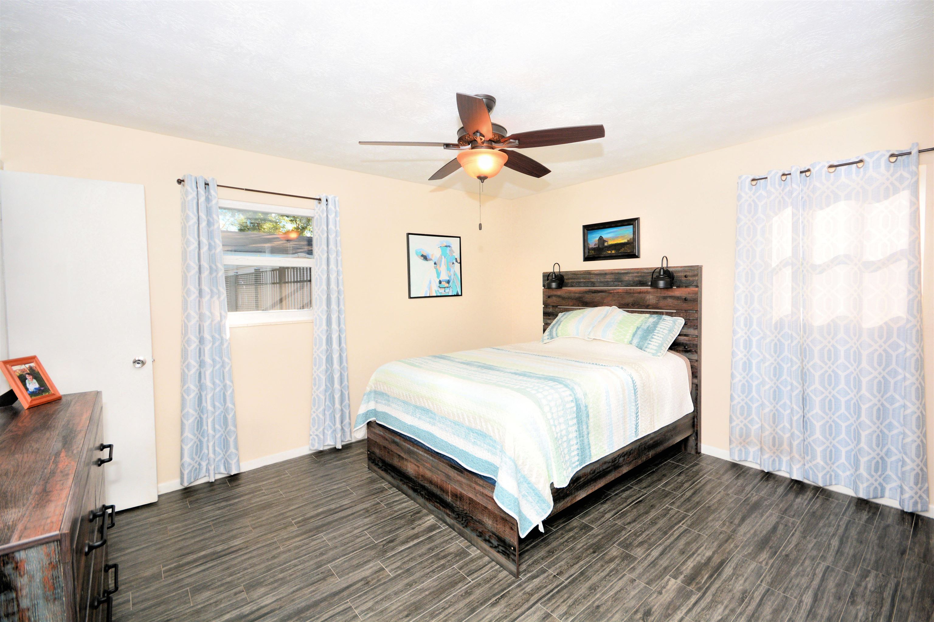 253 Mimosa Road St. Augustine, FL 32086 - Photo 29 of 42 a bedroom with a bed and wooden floor