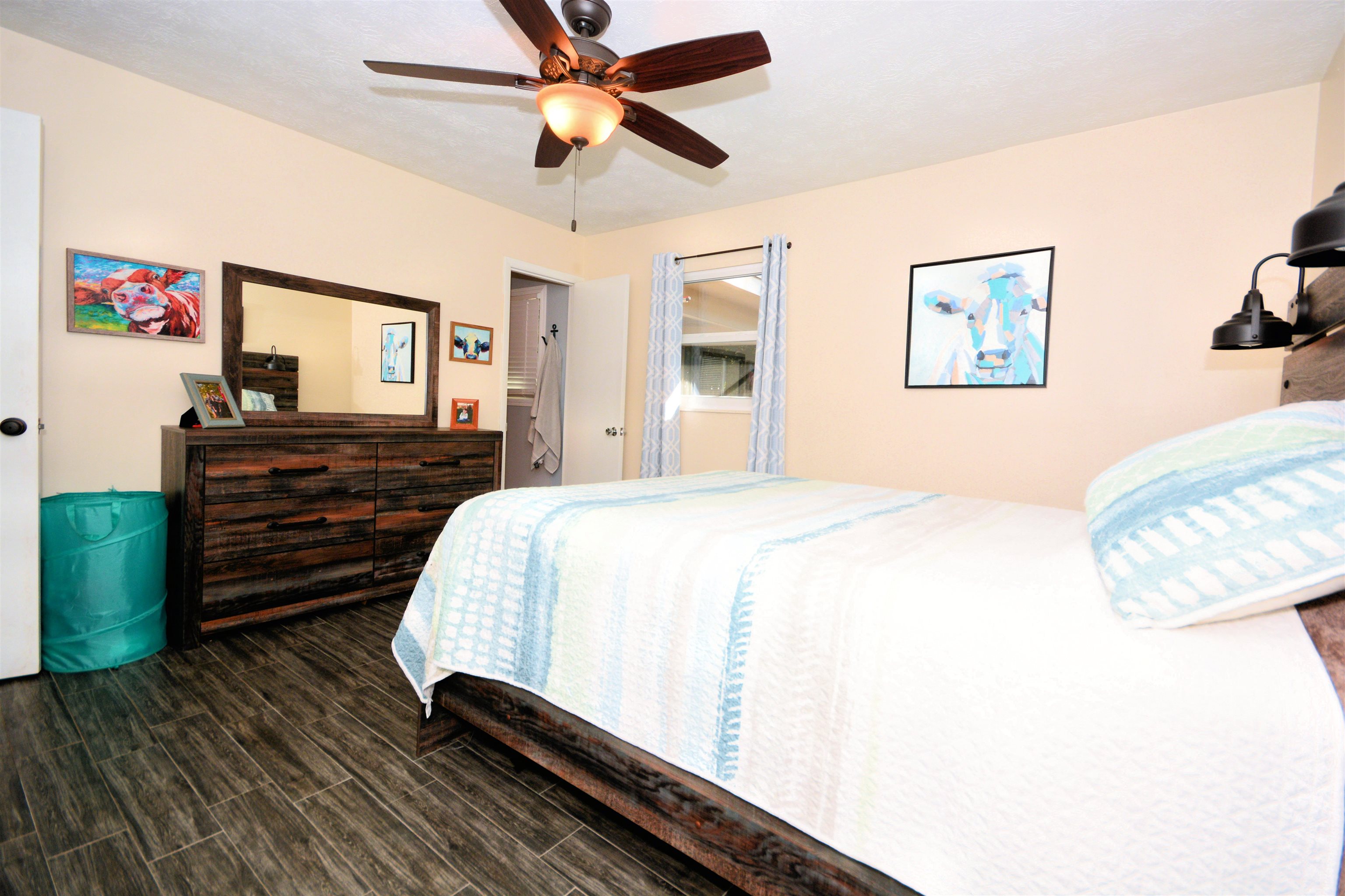 253 Mimosa Road St. Augustine, FL 32086 - Photo 30 of 42 a bedroom with a bed and a chandelier