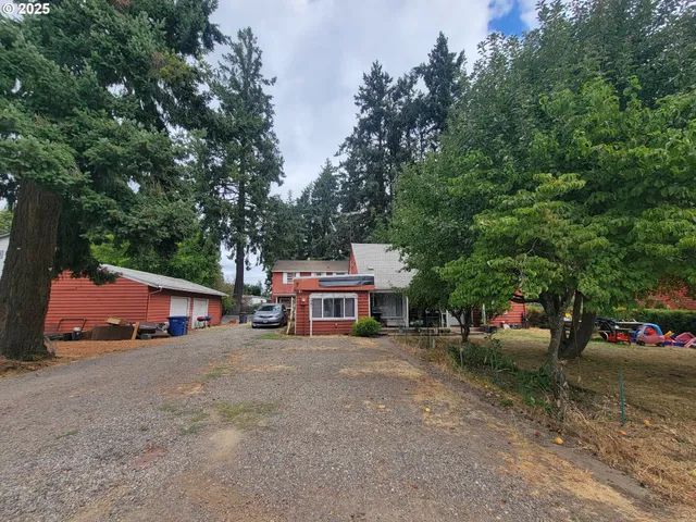 a house view with a sitting space and garden