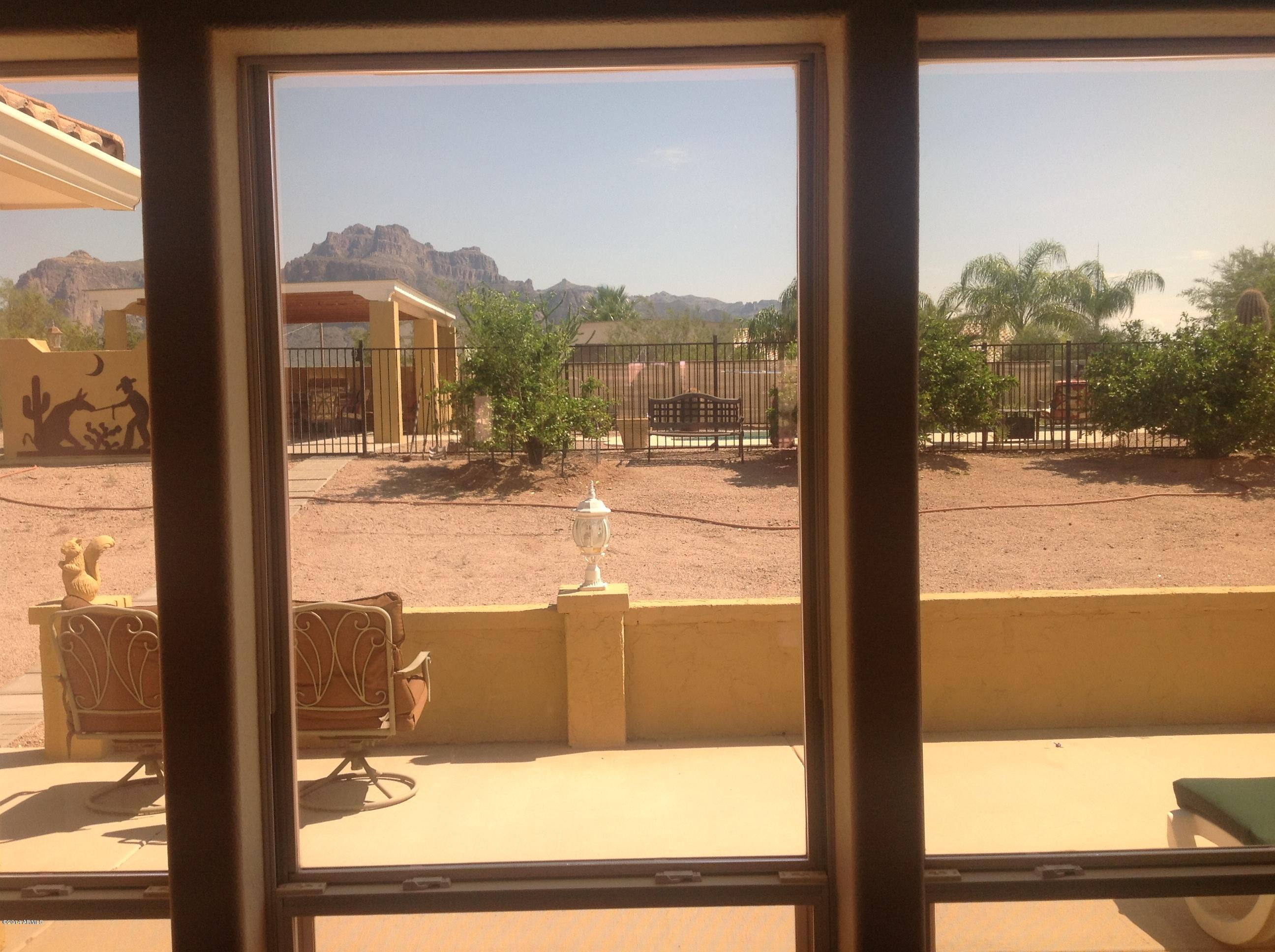 1355 North Acacia Road Apache Junction, AZ 85119 - Photo 13 of 45 a view of a glass door with a glass door