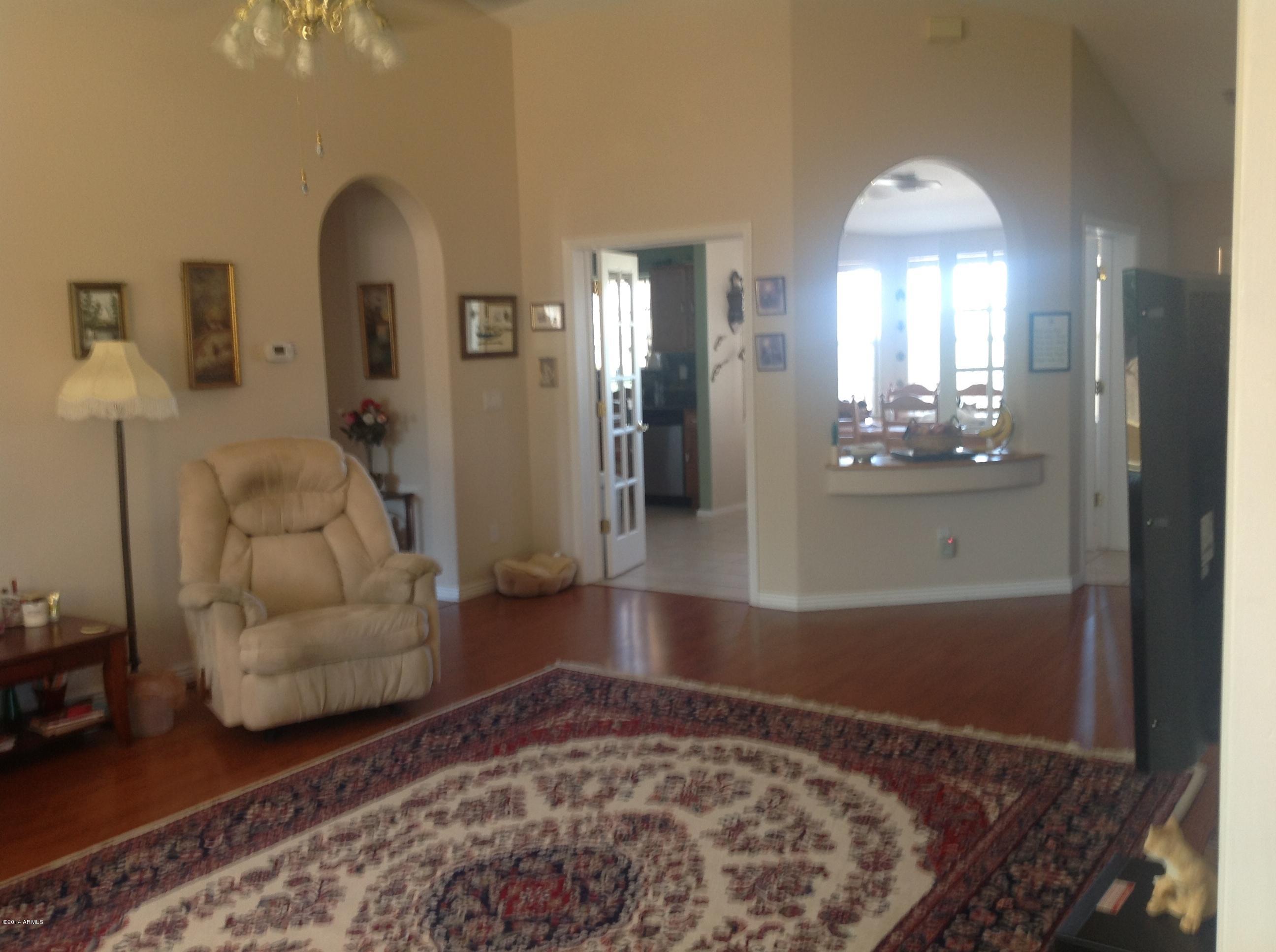 1355 North Acacia Road Apache Junction, AZ 85119 - Photo 18 of 45 a view of a livingroom with furniture and an entryway
