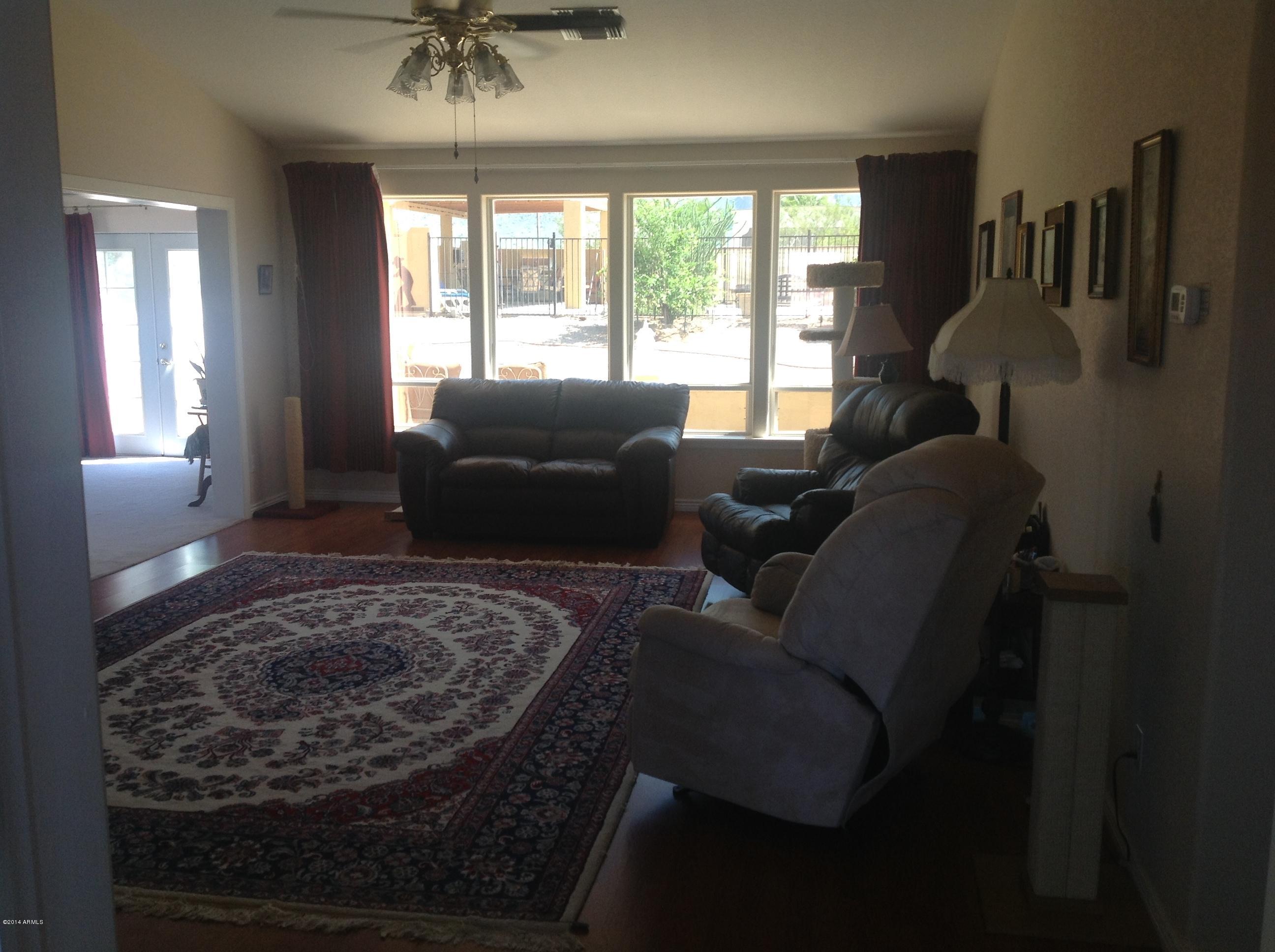 1355 North Acacia Road Apache Junction, AZ 85119 - Photo 19 of 45 a living room with furniture and a window