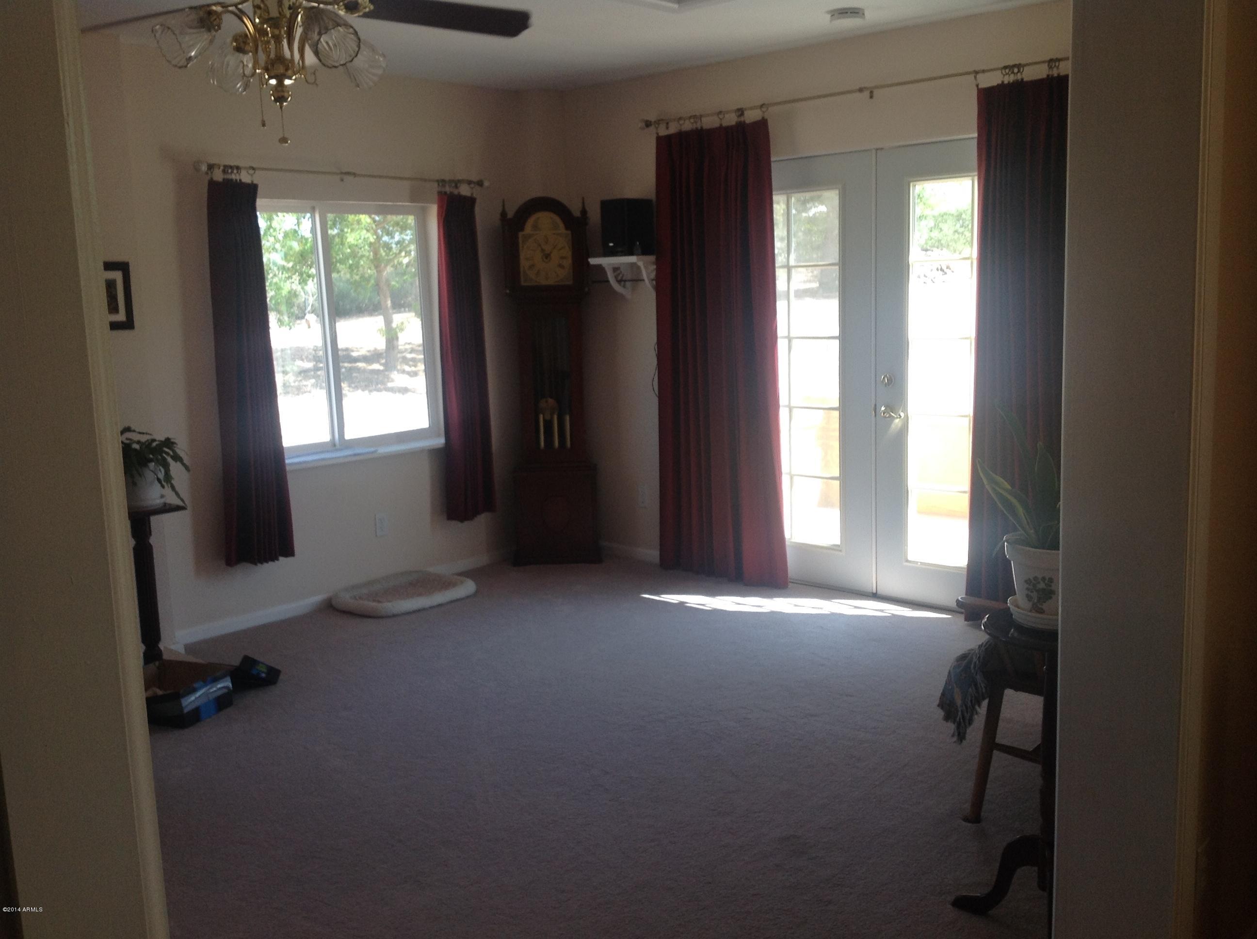 1355 North Acacia Road Apache Junction, AZ 85119 - Photo 21 of 45 a view of empty room with windows and wardrobe