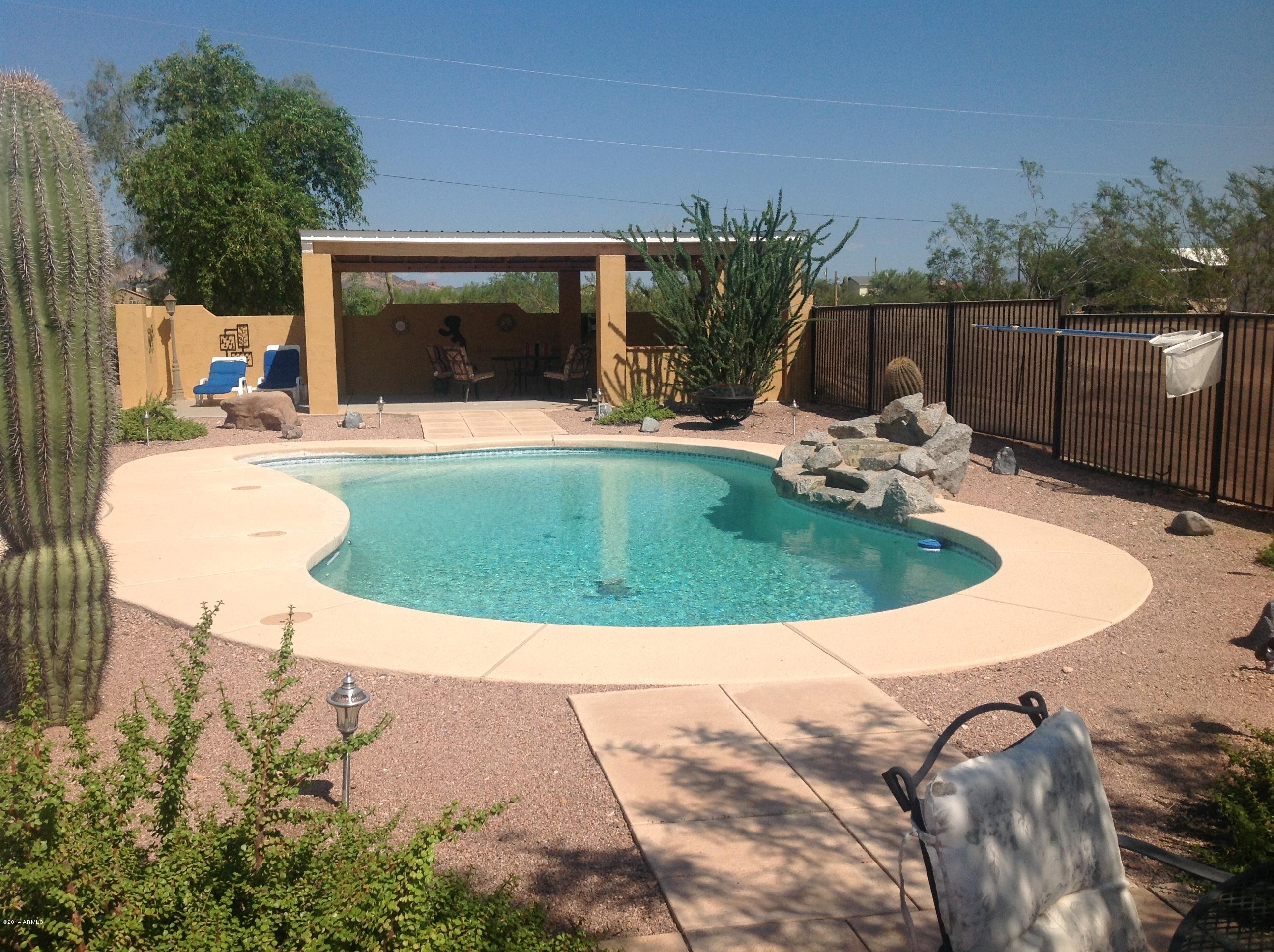 1355 North Acacia Road Apache Junction, AZ 85119 - Photo 38 of 45 a view of outdoor space yard swimming pool and patio