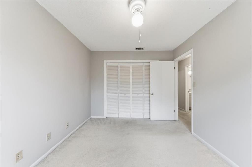 2260 Pernoshal Court Atlanta, GA 30338 - Photo 14 of 46 an empty room with a empty space and a ceiling fan