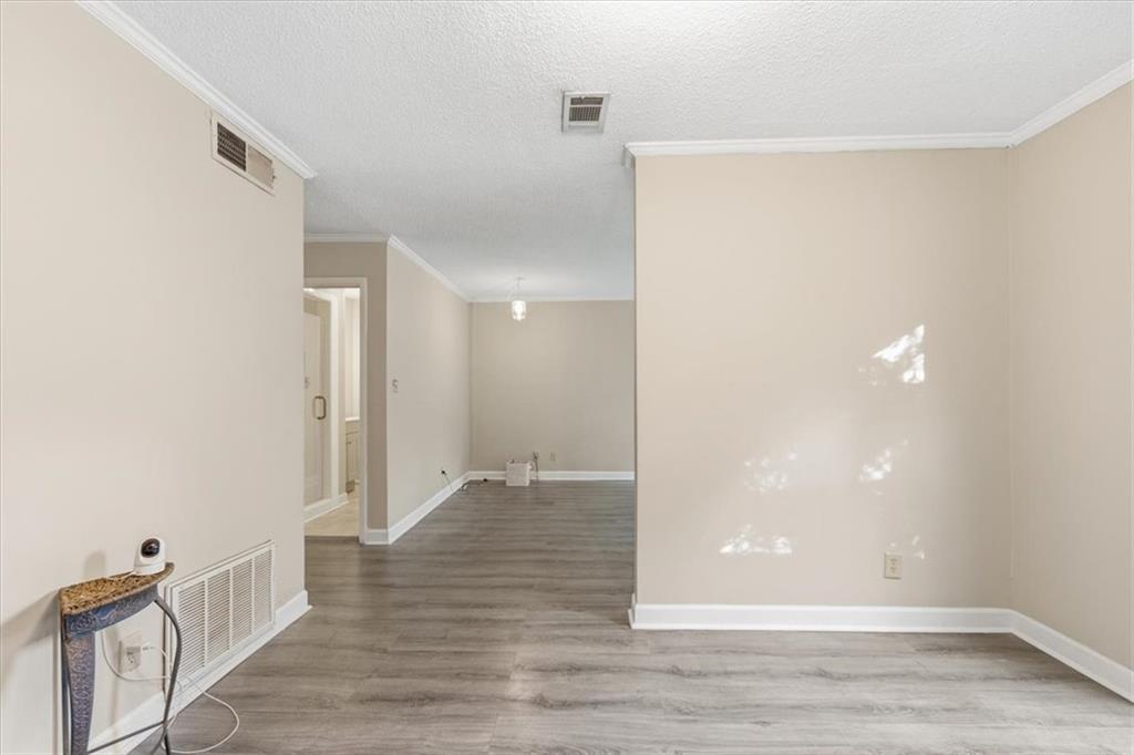 2260 Pernoshal Court Atlanta, GA 30338 - Photo 22 of 46 a view of a hallway with wooden floor
