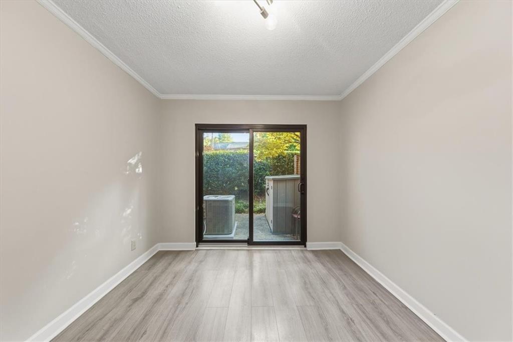 2260 Pernoshal Court Atlanta, GA 30338 - Photo 24 of 46 wooden floor in an empty room with a window