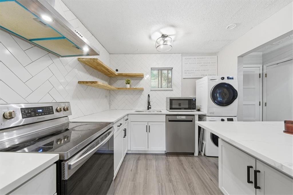 2260 Pernoshal Court Atlanta, GA 30338 - Photo 26 of 46 a kitchen with a stove oven and sink