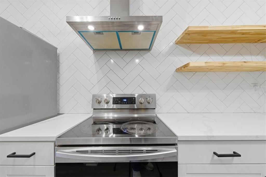 2260 Pernoshal Court Atlanta, GA 30338 - Photo 29 of 46 a stove top oven sitting inside of a kitchen