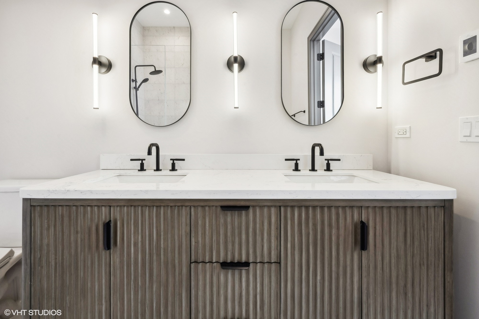 1615 West Irving Park Road, Unit 1S Chicago, IL 60613 - Photo 13 of 19 a bathroom with a sink and a mirror