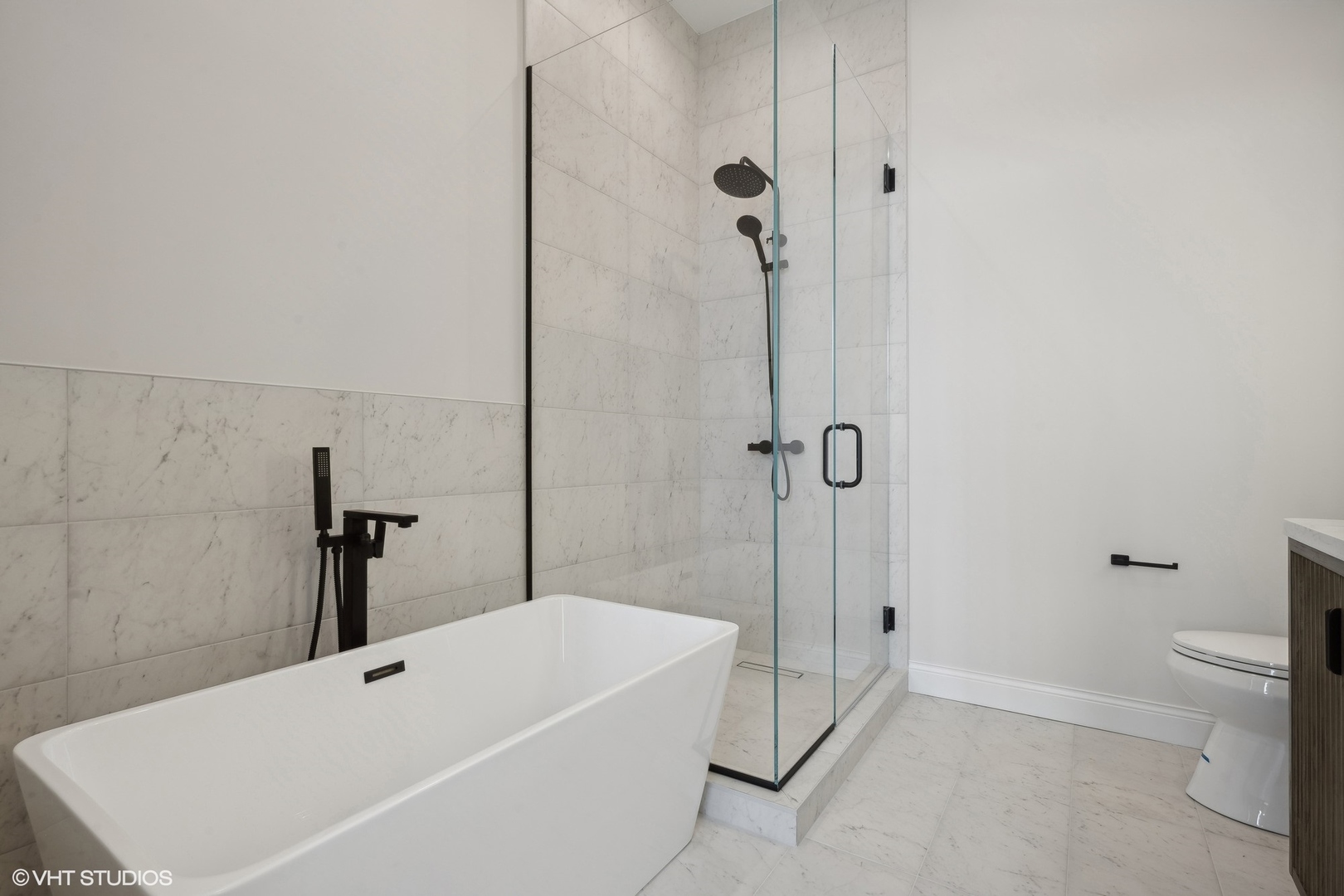 1615 West Irving Park Road, Unit 1S Chicago, IL 60613 - Photo 14 of 19 a bathroom with a bathtub and a shower