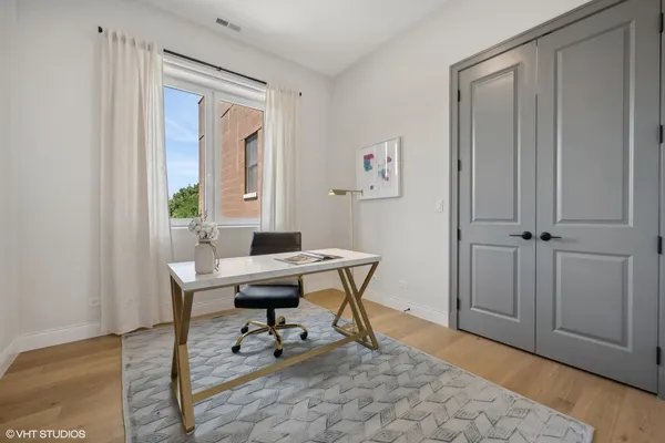 a work room with furniture and a window
