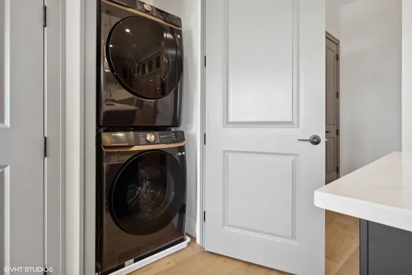 a view of a hallway with washer and dryer