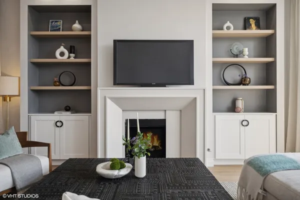 a living room with furniture and a fireplace
