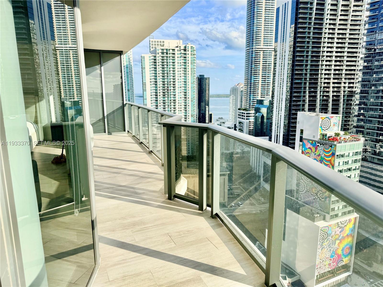 45 Southwest 9th Street, Unit 2606 Miami, FL 33130 - Photo 16 of 20 a view of balcony with wooden floor and floor