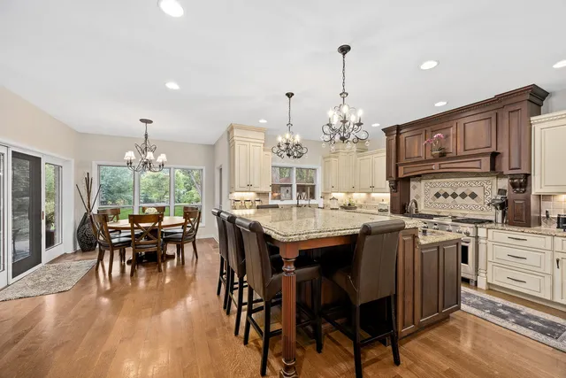 a kitchen with stainless steel appliances granite countertop a stove and a sink