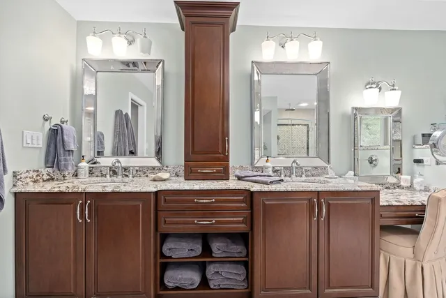 a spacious bedroom with a bed and window