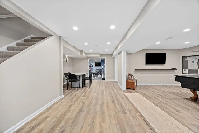 a wooden bench sitting in front of a building