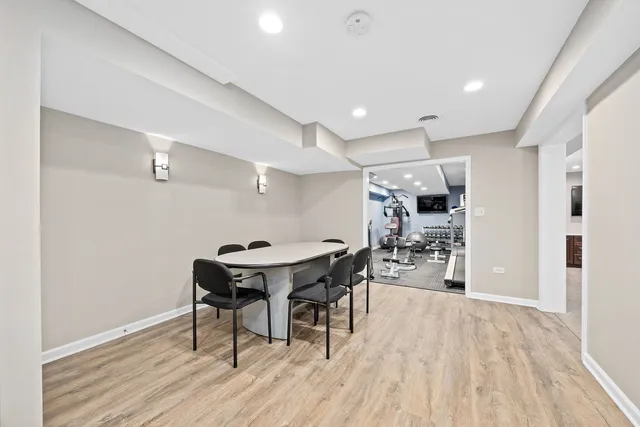 an aerial view of a house with a yard and outdoor seating