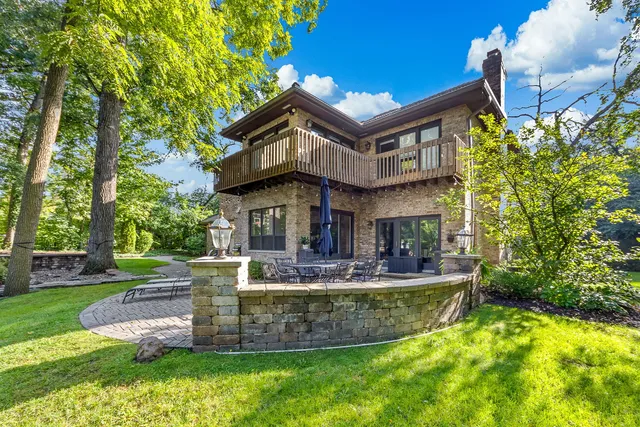 a picture of a wall with a white building and a painting