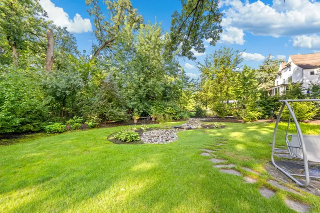 a view of a golf course with a tree