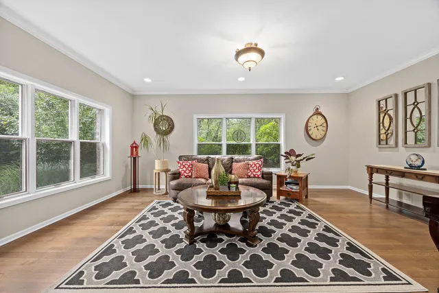 a living room with furniture a window and a table
