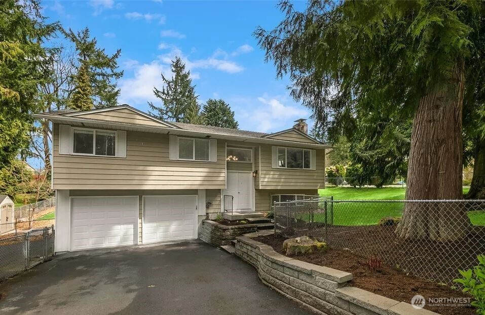a view of a yard with a house and a fire pit