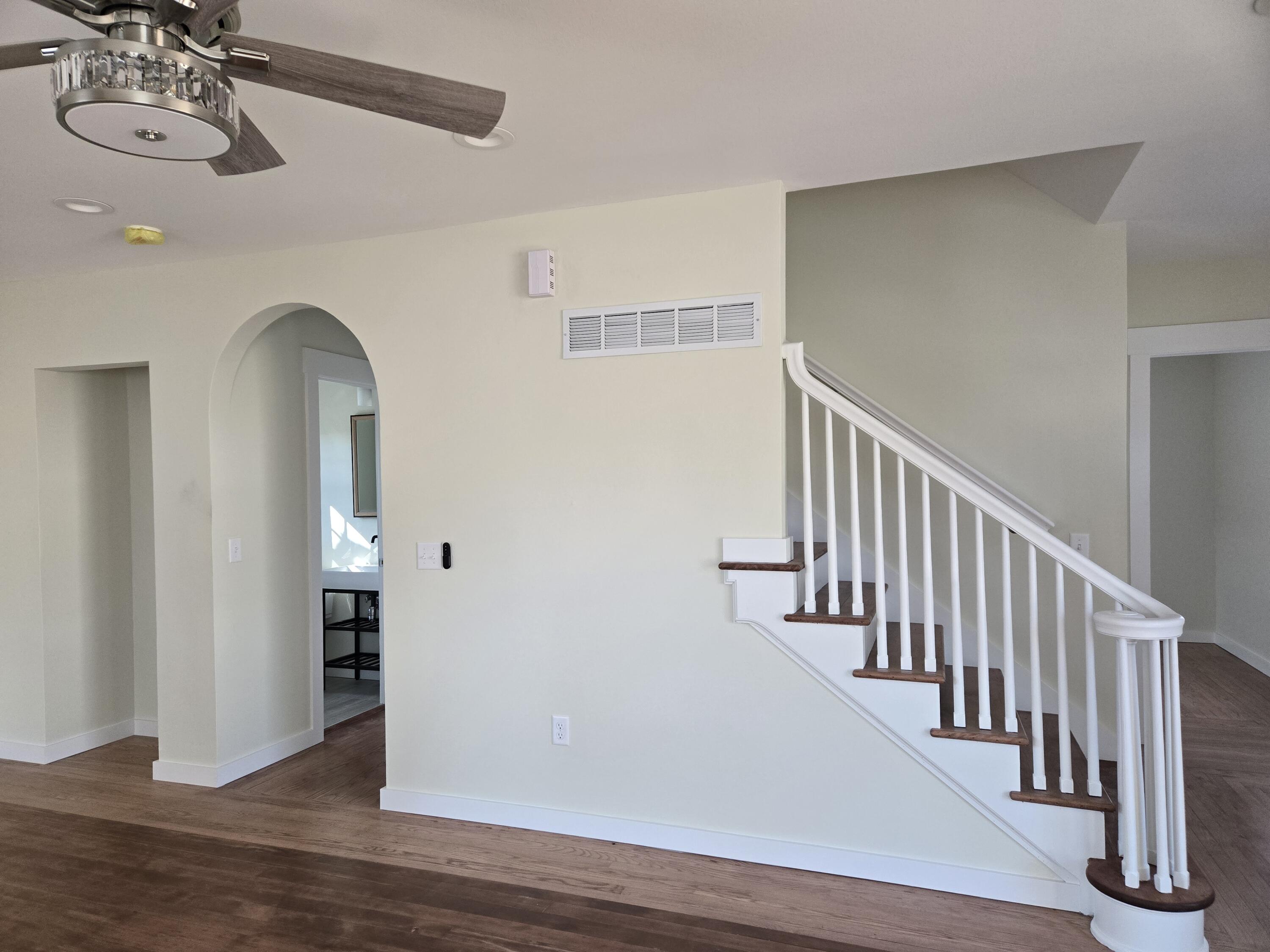 252 East Washington Street Jefferson, WI 53549 - Photo 9 of 24 staircase up in living room