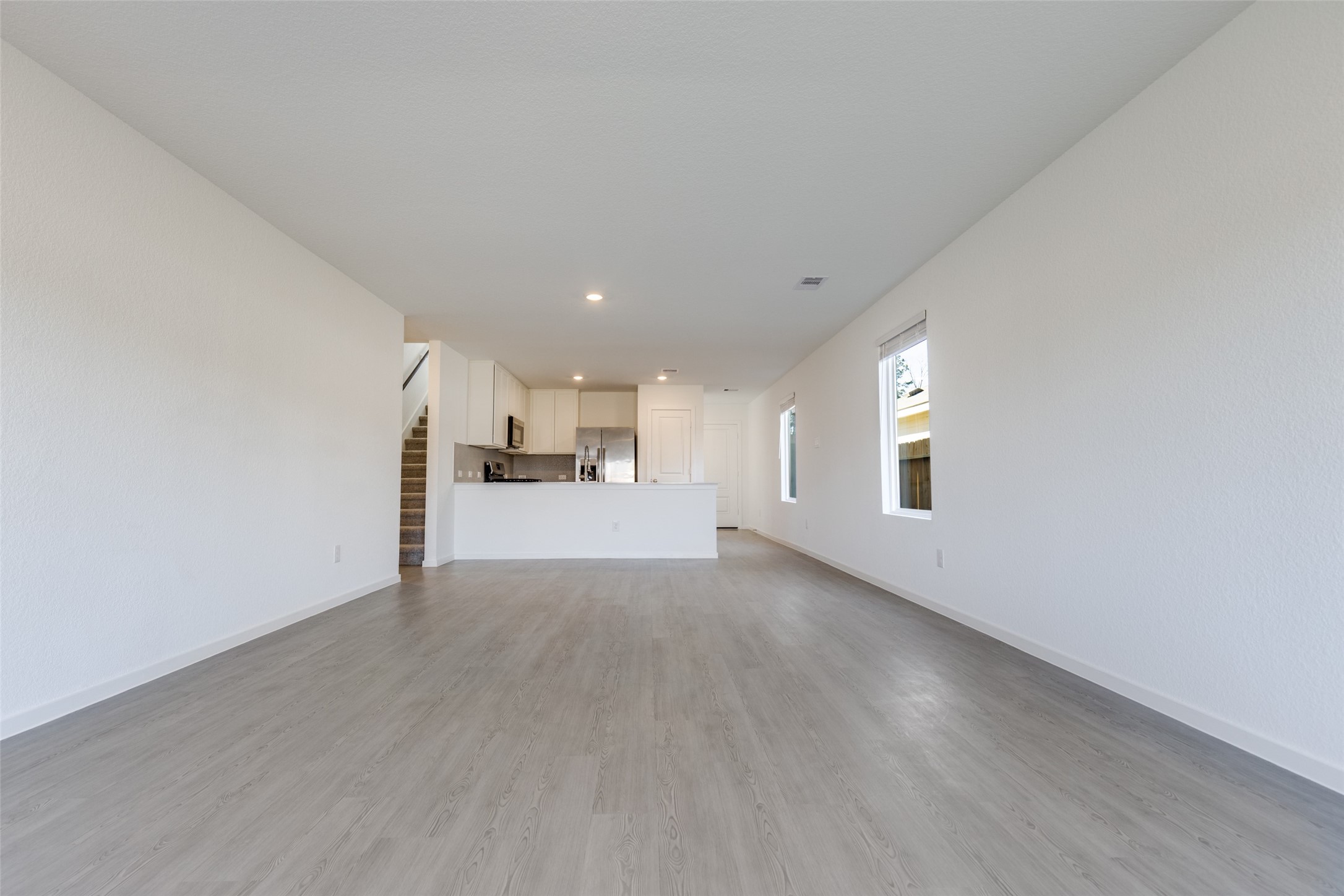 1528 Sunset Ridge Drive Conroe, TX 77303 - Photo 6 of 22 Dining and living room space. Great natural light!