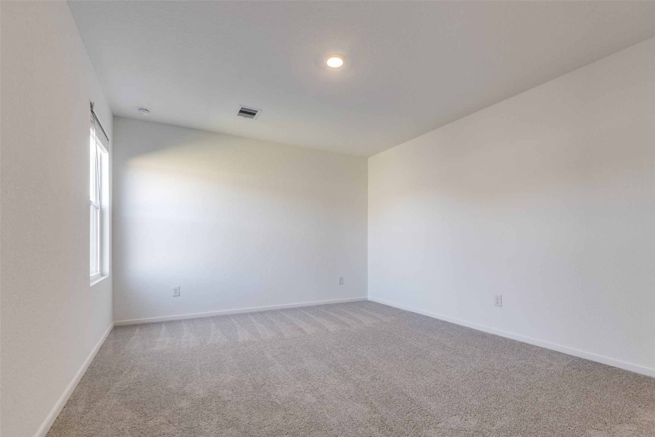 1528 Sunset Ridge Drive Conroe, TX 77303 - Photo 9 of 22 Primary bedroom on the first floor towards the back of the home that offers privacy.