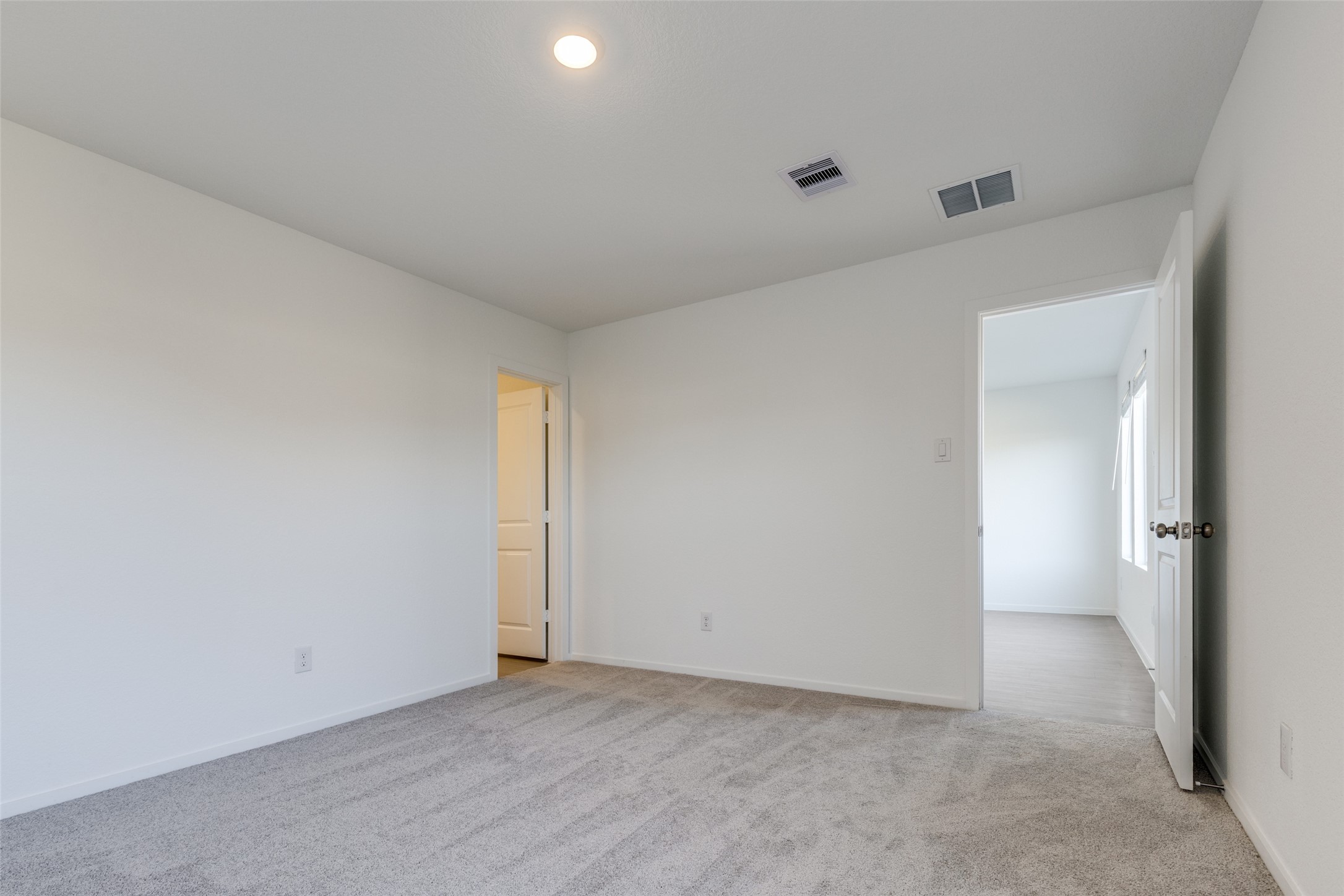 1528 Sunset Ridge Drive Conroe, TX 77303 - Photo 10 of 22 Primary bedroom on the first floor towards the back of the home that offers privacy.