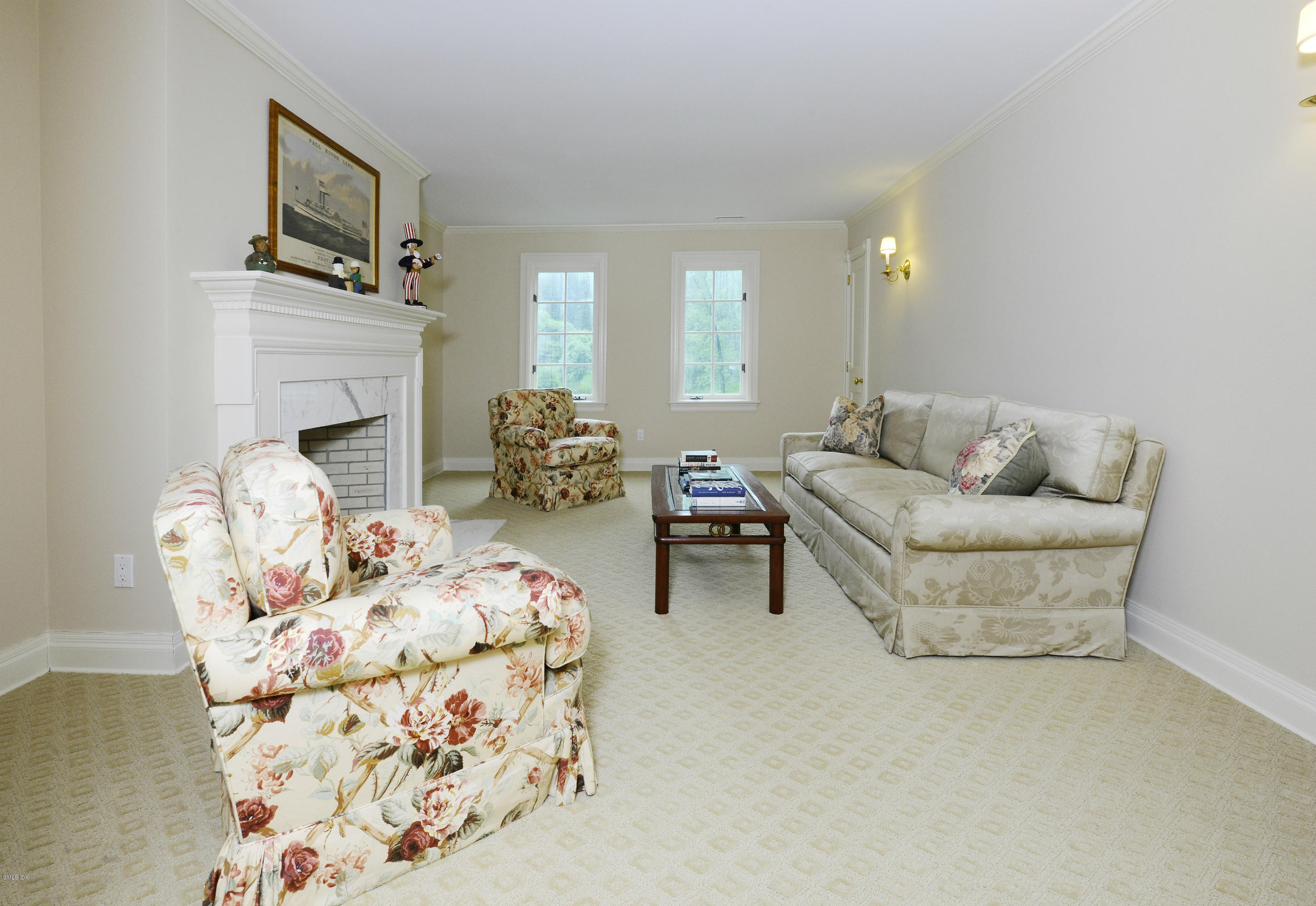 80 Clapboard Ridge Road Greenwich, CT 06830 - Photo 18 of 27 a living room with furniture and a fireplace