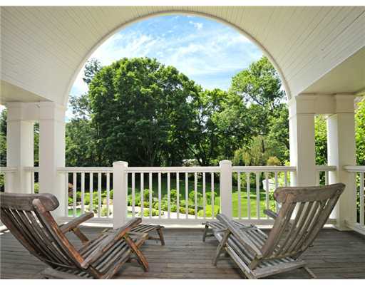 80 Clapboard Ridge Road Greenwich, CT 06830 - Photo 20 of 27 a view of a chair and table on the patio