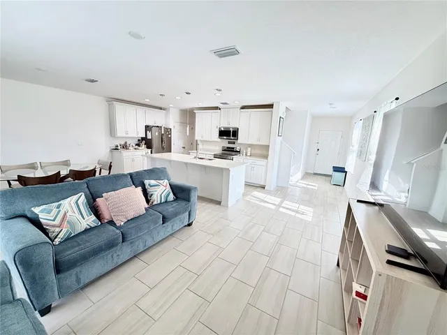 a living room with furniture and a rug