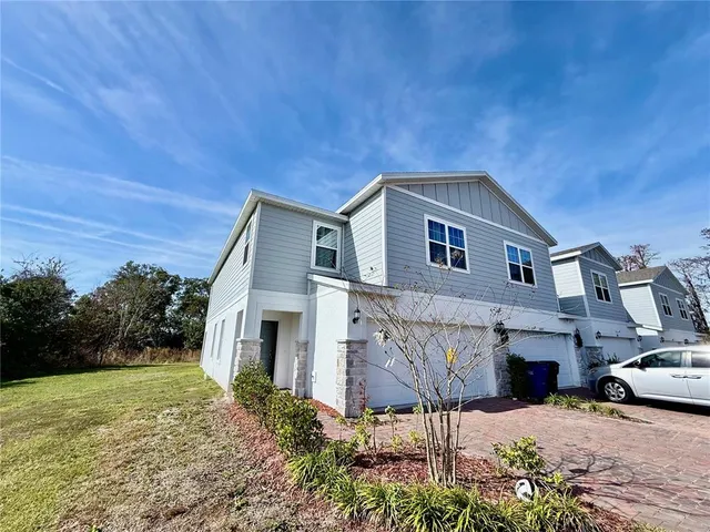 a front view of a house with yard