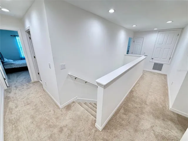 a bed room with a bed and a chair