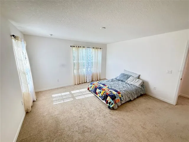 a bathroom with a double vanity sink mirror and shower